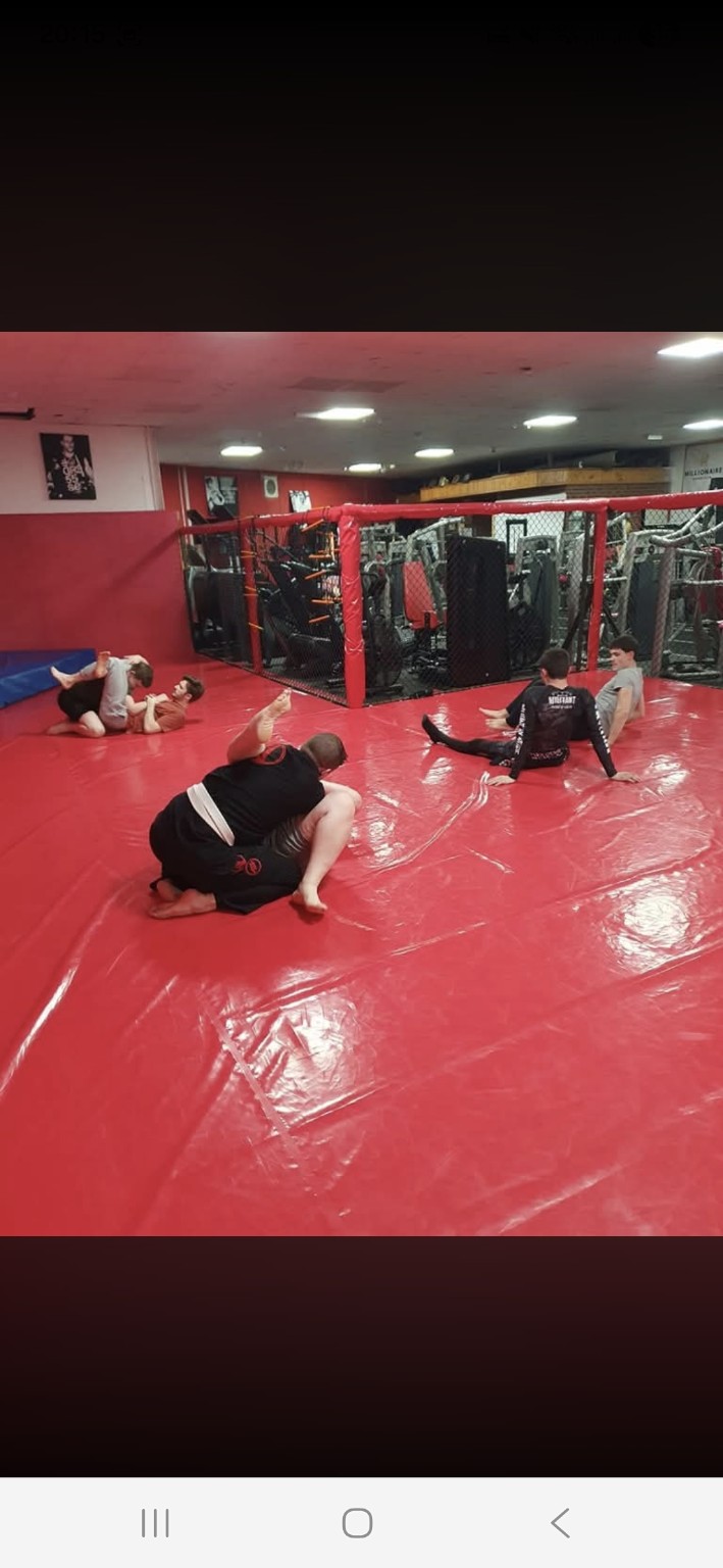 Heat MMA training floor and cage